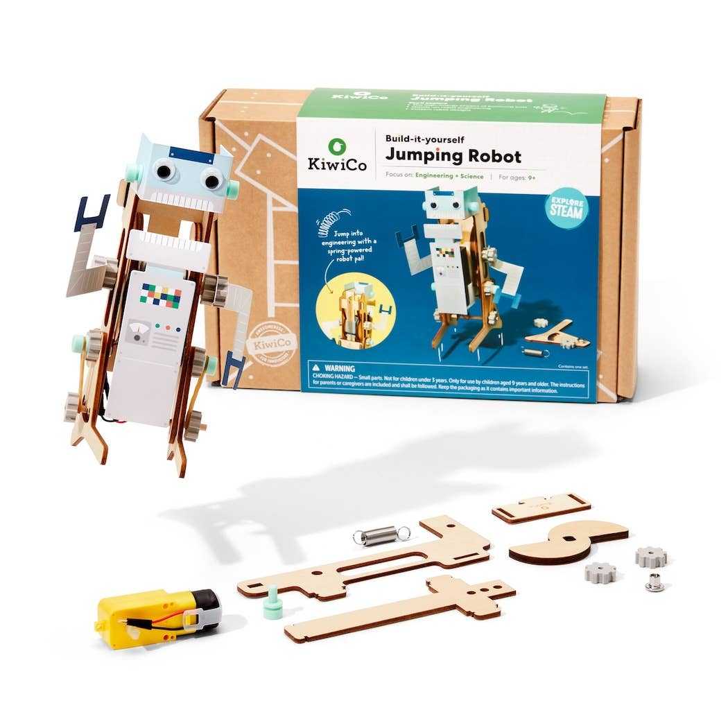 Jumping Robot STEM building kit for kids with wooden parts, spring mechanism, motor, and customizable robot figure by KiwiCo