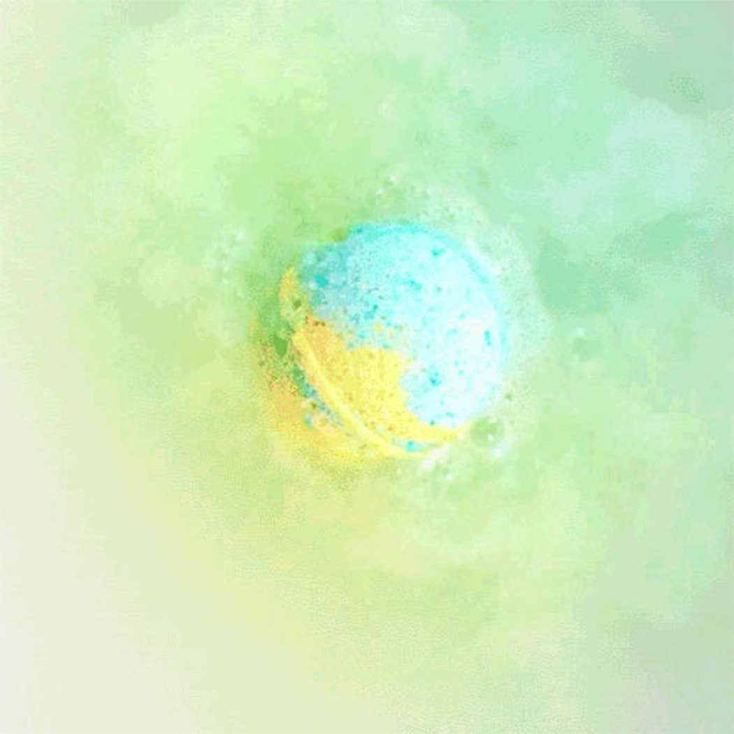 Blue and yellow planet-shaped bath bomb fizzing in water from Planet Bath-Bombs Science Kit for kids