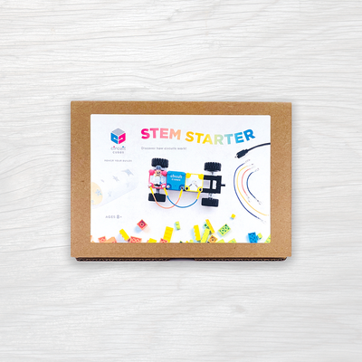 Circuit Cubes STEM Starter Kit with battery, motor, LED cubes, wheels, and LEGO-compatible bricks for kids aged 8+ learning circuits and motion.