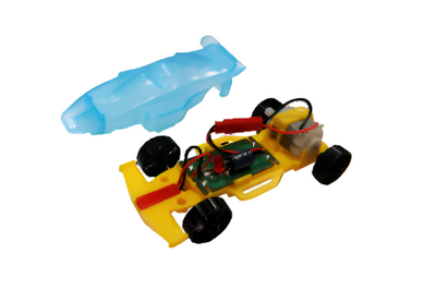 Kinetic Racer educational toy car with transparent body and visible internal hand crank generator components for sustainable energy learning.