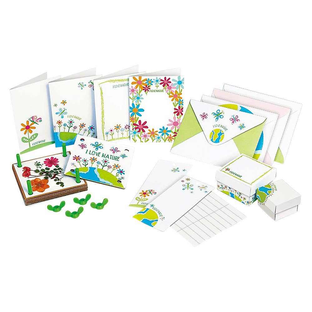 Pressed flower art kit with handmade greeting cards, envelopes, trinket boxes, and flower pressing tools for nature crafts.