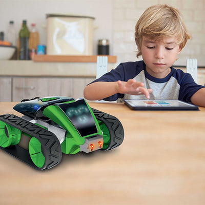 Child programming a green robotic smart machine with tablet in a home setting