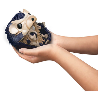 Hands holding a built robotic pet hedgehog toy with visible gears and blue spines