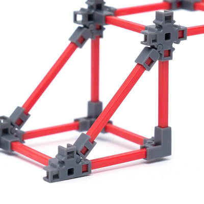Bridge Architect building kit with red slanted beams and gray connectors for constructing bridge structures without glue or tools