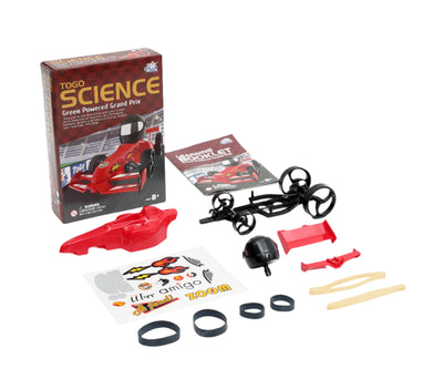 Green Powered Grand Prix rubber band race car kit with red car body, black chassis, stickers, rubber bands, and instruction booklet