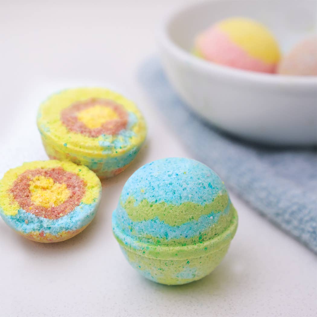 Colorful planet-themed bath bombs made with the Planet Bath-Bombs Science Kit for kids' educational bath time fun