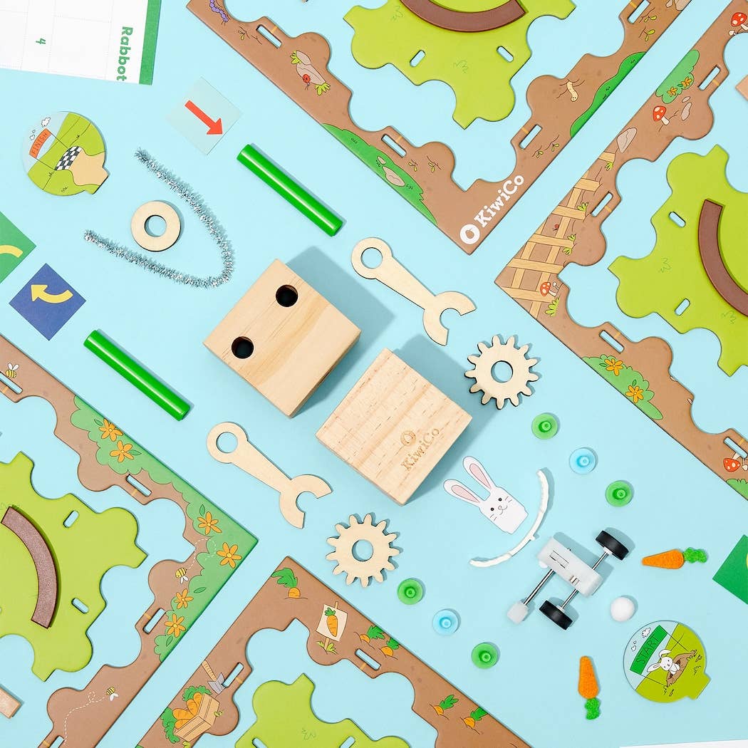 Robot Coder Starter Kit DIY science kit with wooden parts, puzzle pieces, and coding activity for kids.