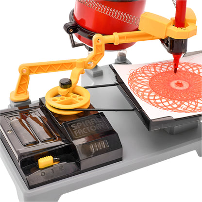 STEM science set for kids creating spiral art with markers on paper.