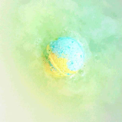 Blue and yellow planet-shaped bath bomb fizzing in water from Planet Bath-Bombs Science Kit for kids